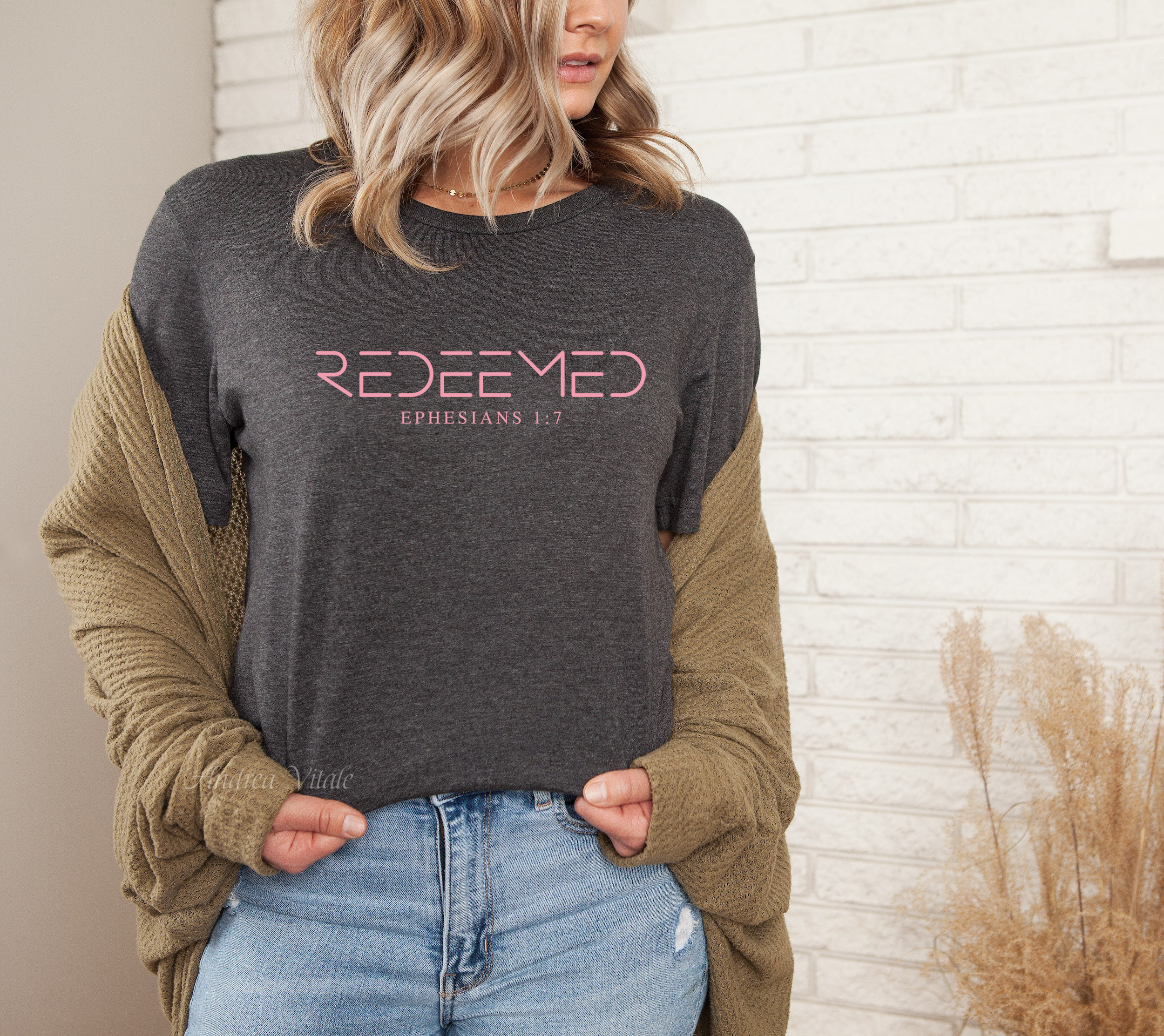 Redeemed Ephesians 1:7 with Flamingo Colour Text (like a pink)  Bella Canvas 3001 Dark Grey Heather Sky Angel Cafe